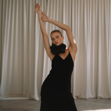 Woman wearing a black velvet dress with floral neck choker | Gina Kim