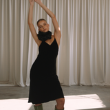 Woman wearing a black velvet dress with floral neck choker | Gina Kim
