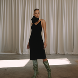 Woman wearing a black velvet dress with floral neck choker | Gina Kim
