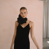 Woman wearing a black velvet dress with floral neck choker | Gina Kim