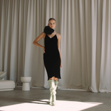 Woman wearing a black velvet dress with floral neck choker | Gina Kim