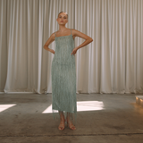 Sage colour backless maxi dress with tassels all over the dress & strap and a side split | Gina Kim