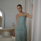 Sage colour backless maxi dress with tassels all over the dress & strap and a side split | Gina Kim