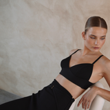 Adjustable black straps bra top and midi length skirt set from the side | Gina Kim