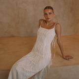 White low back maxi dress with tassels all over the dress & strap and a side split | Gina Kim
